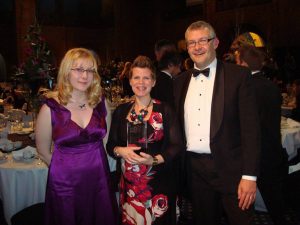 Business_Awards_2009 Rea, Jo and Mark holding their Community Commitment Award.
